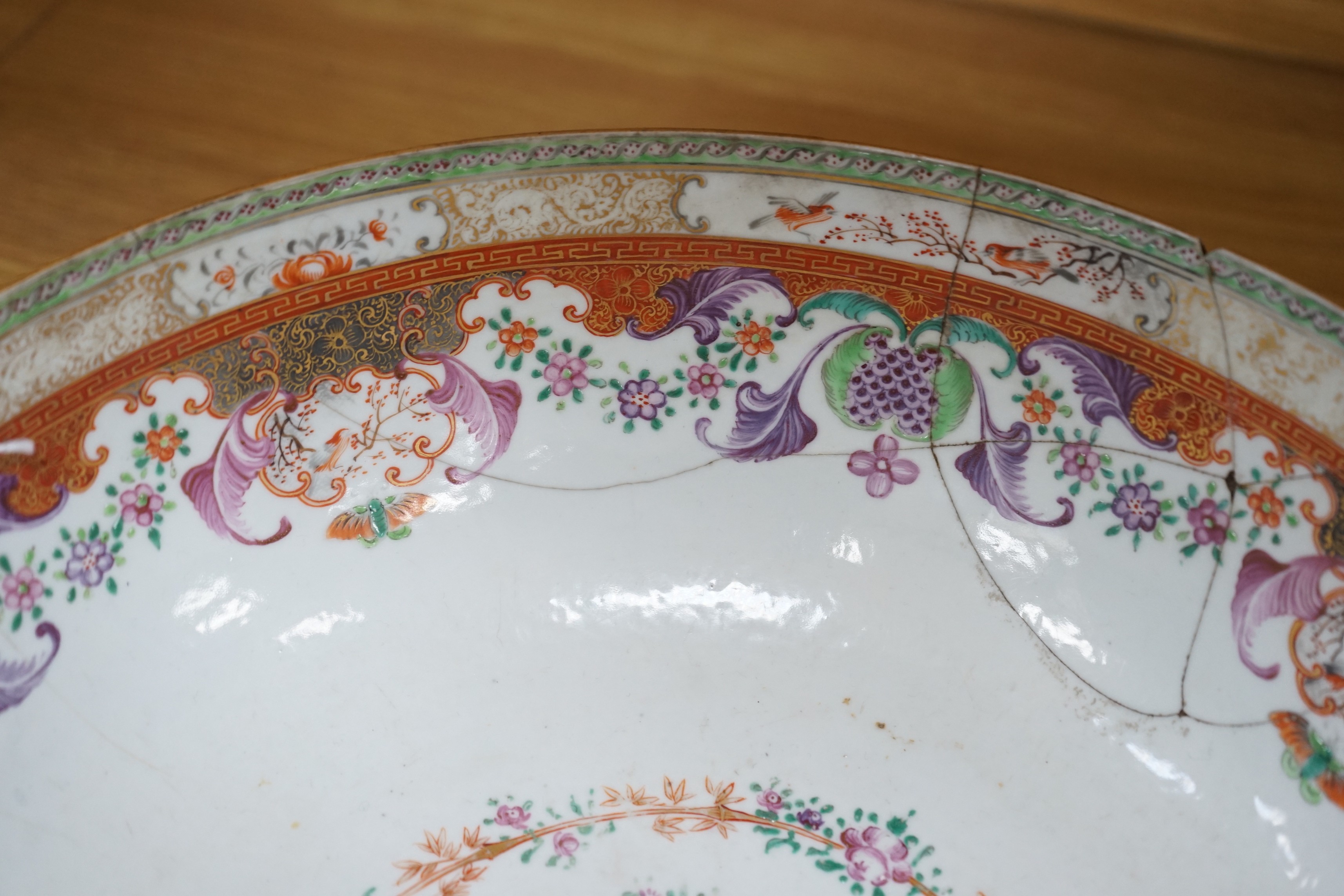An 18th century Chinese export famille rose ‘mandarin’ punch bowl, 31cm diameter (af)